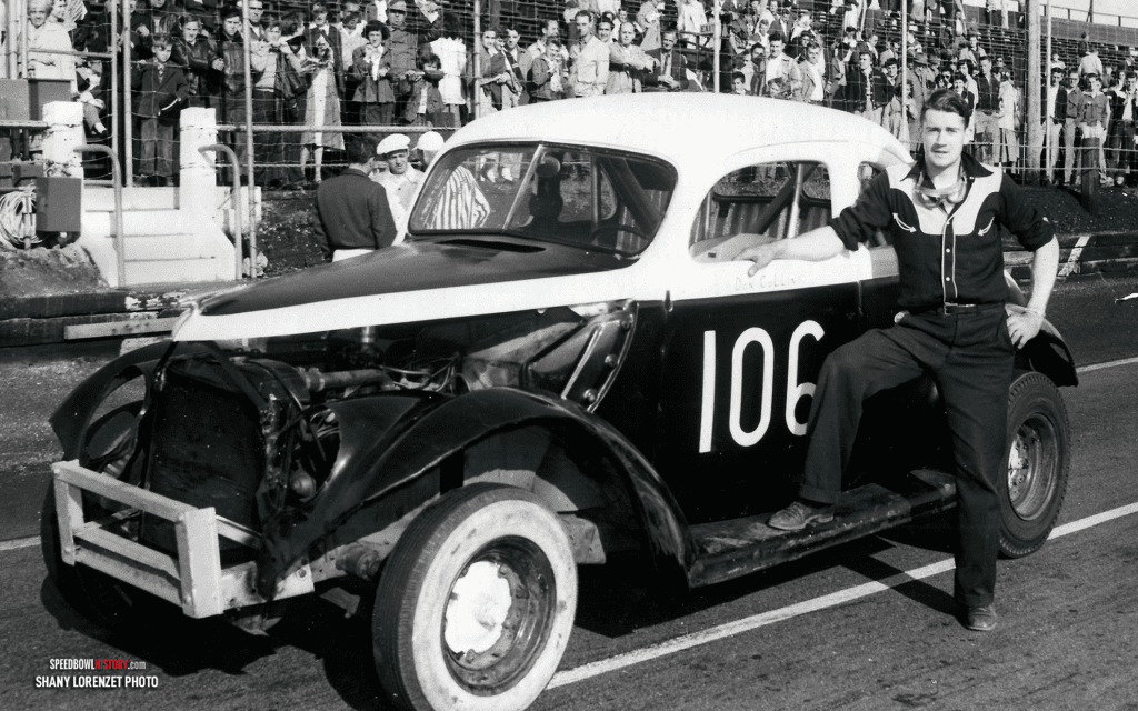 Black and white abstract pattern with concentric circles and wave shapes.