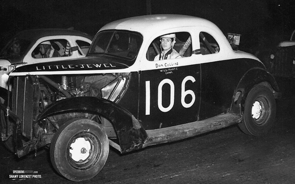 Black and white abstract pattern with concentric circles and wave shapes.