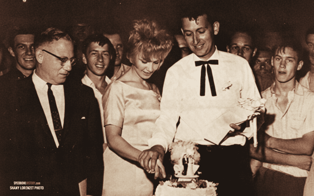 Black and white abstract pattern with concentric circles and wave shapes.