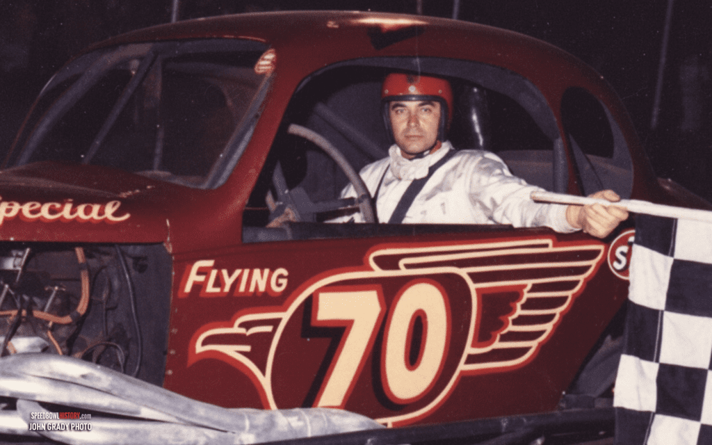 Black and white abstract pattern with concentric circles and wave shapes.