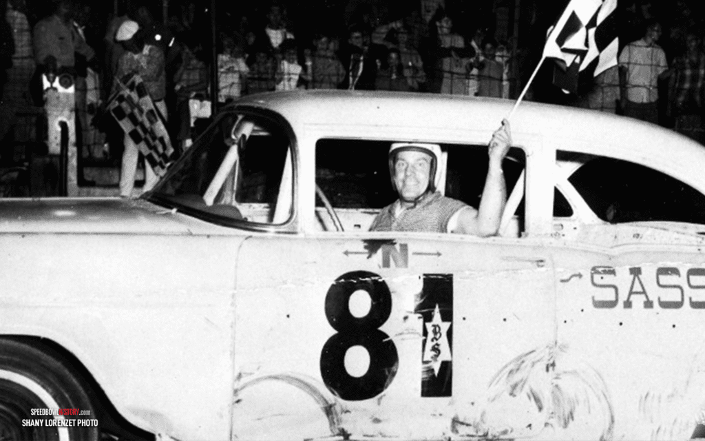 Black and white abstract pattern with concentric circles and wave shapes.