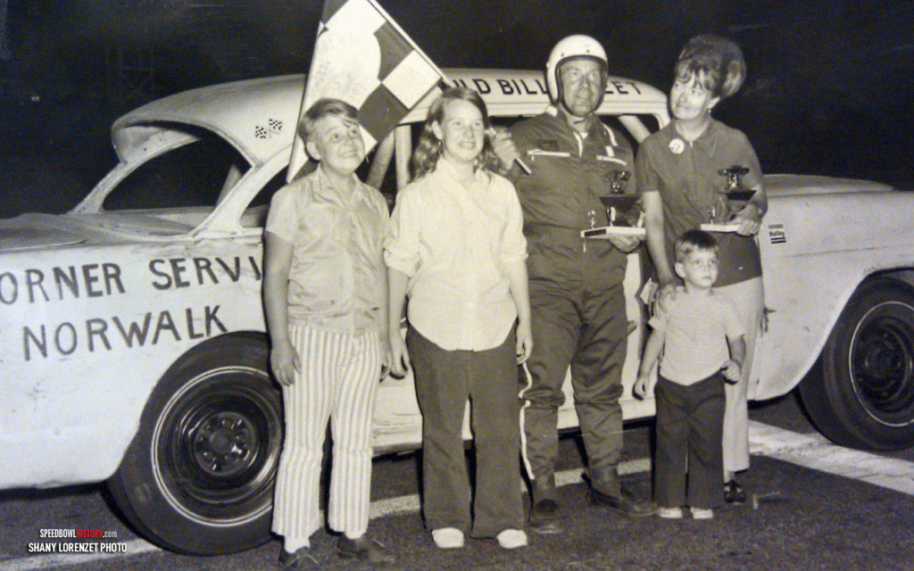 Black and white abstract pattern with concentric circles and wave shapes.