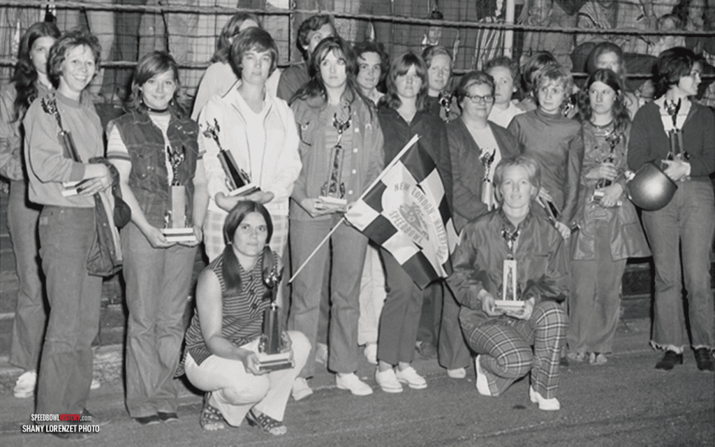 Black and white abstract pattern with concentric circles and wave shapes.