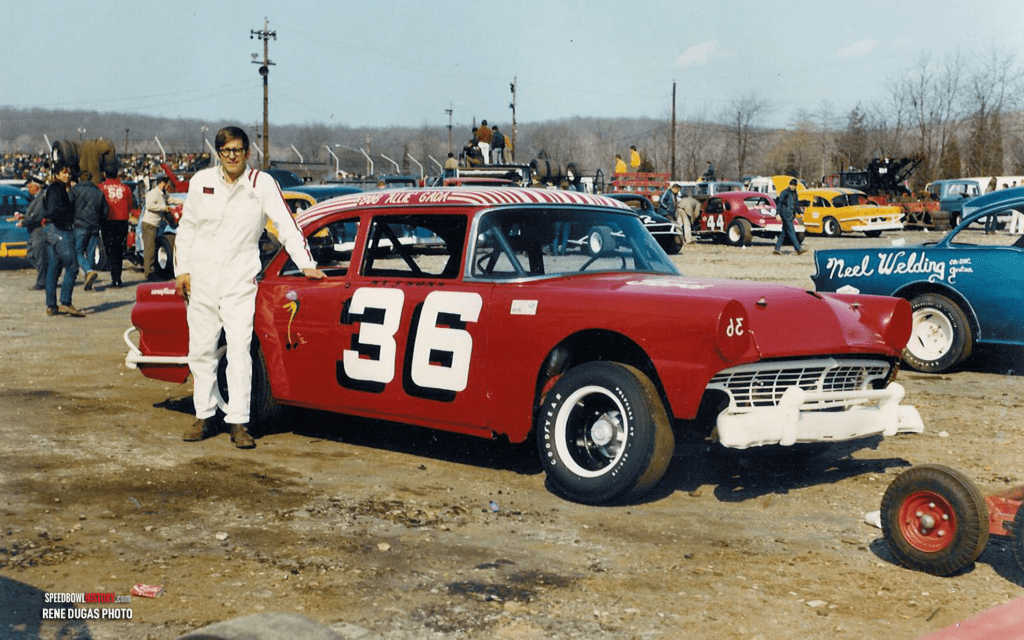 Black and white abstract pattern with concentric circles and wave shapes.