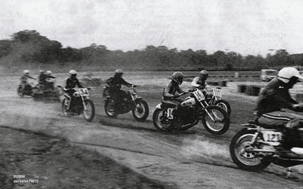 Black and white abstract pattern with concentric circles and wave shapes.