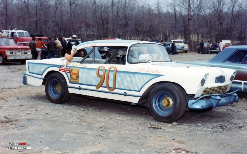 Black and white abstract pattern with concentric circles and wave shapes.