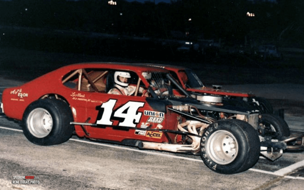 Black and white abstract pattern with concentric circles and wave shapes.