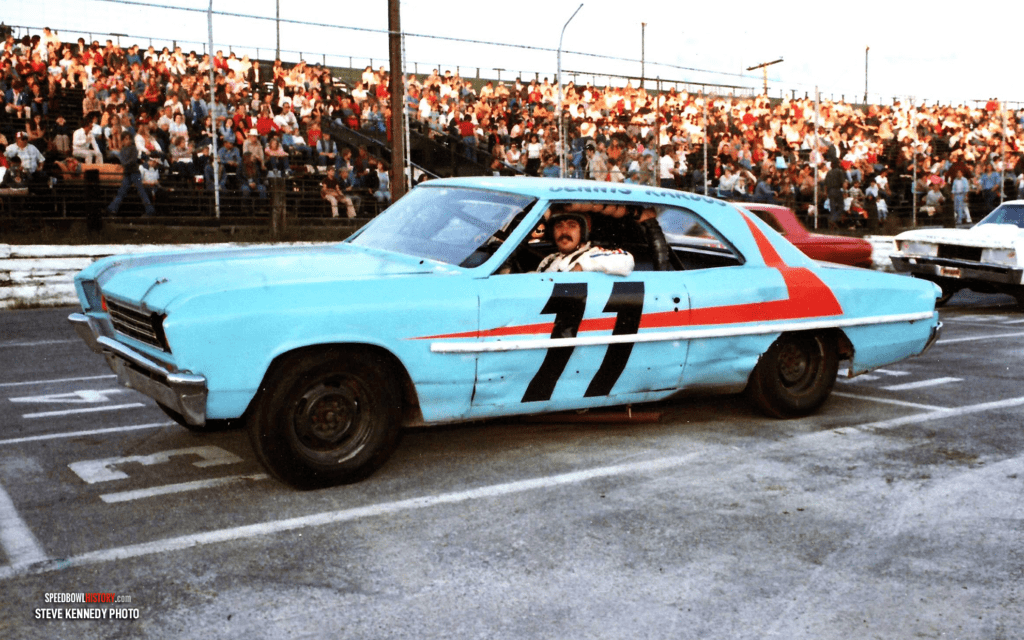 Black and white abstract pattern with concentric circles and wave shapes.