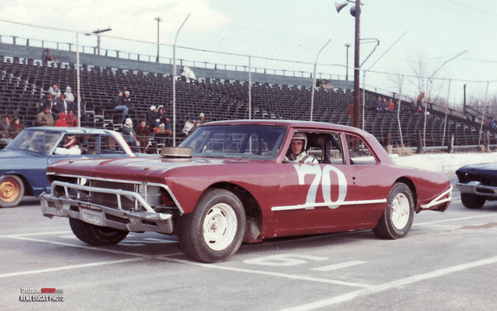 Black and white abstract pattern with concentric circles and wave shapes.