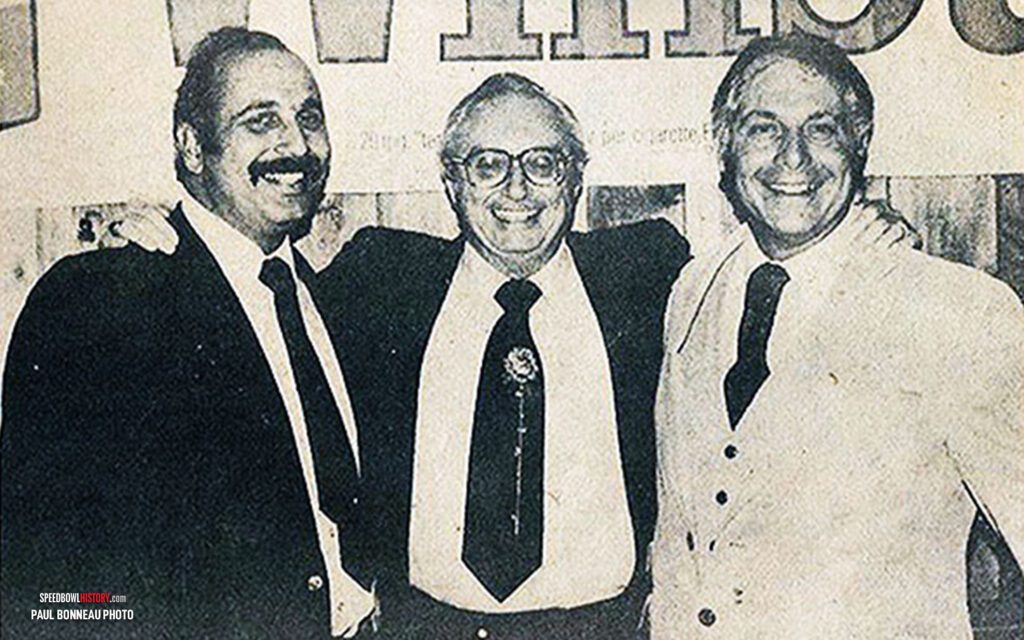 Black and white abstract pattern with concentric circles and wave shapes.