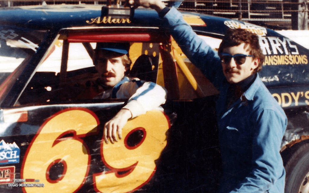 Black and white abstract pattern with concentric circles and wave shapes.