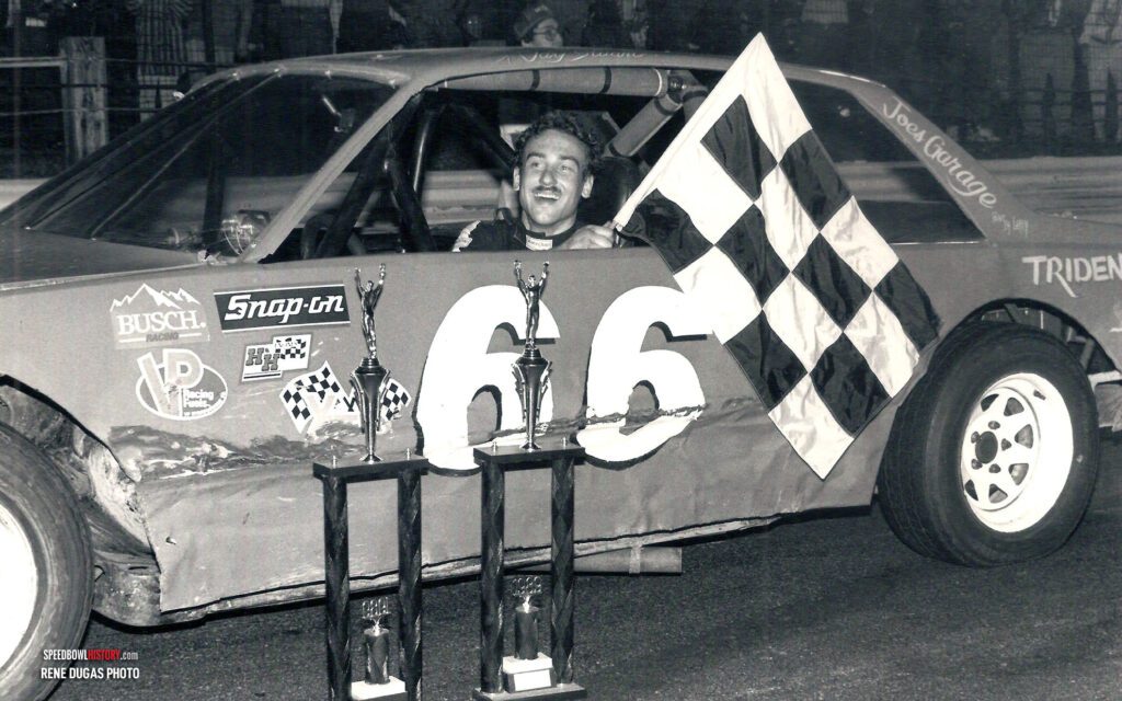 Black and white abstract pattern with concentric circles and wave shapes.