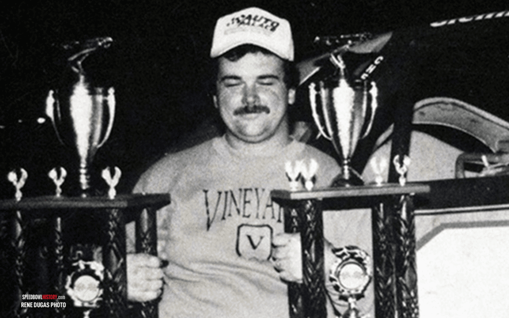 Black and white abstract pattern with concentric circles and wave shapes.