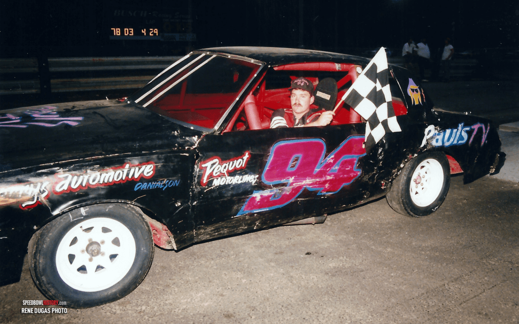 Black and white abstract pattern with concentric circles and wave shapes.