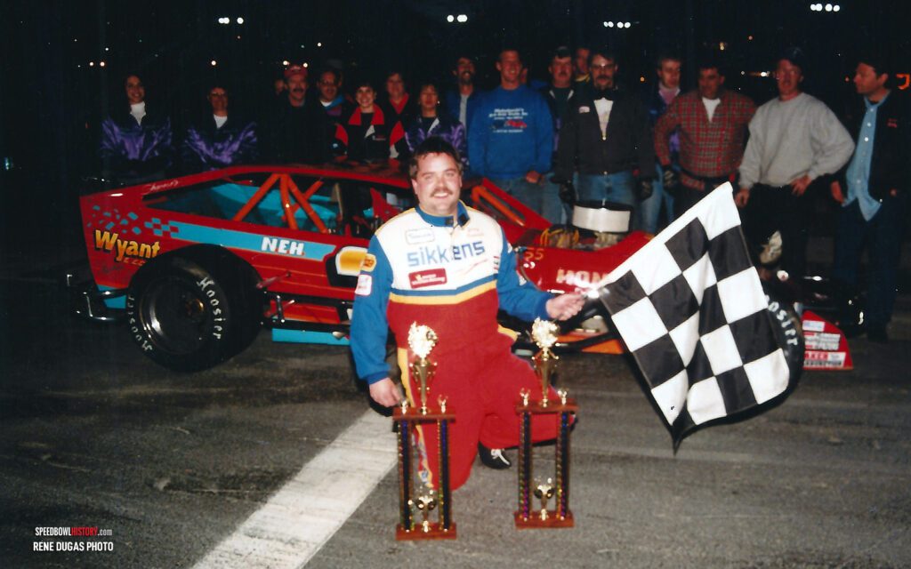 Black and white abstract pattern with concentric circles and wave shapes.