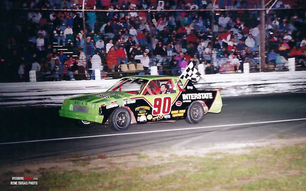 Black and white abstract pattern with concentric circles and wave shapes.