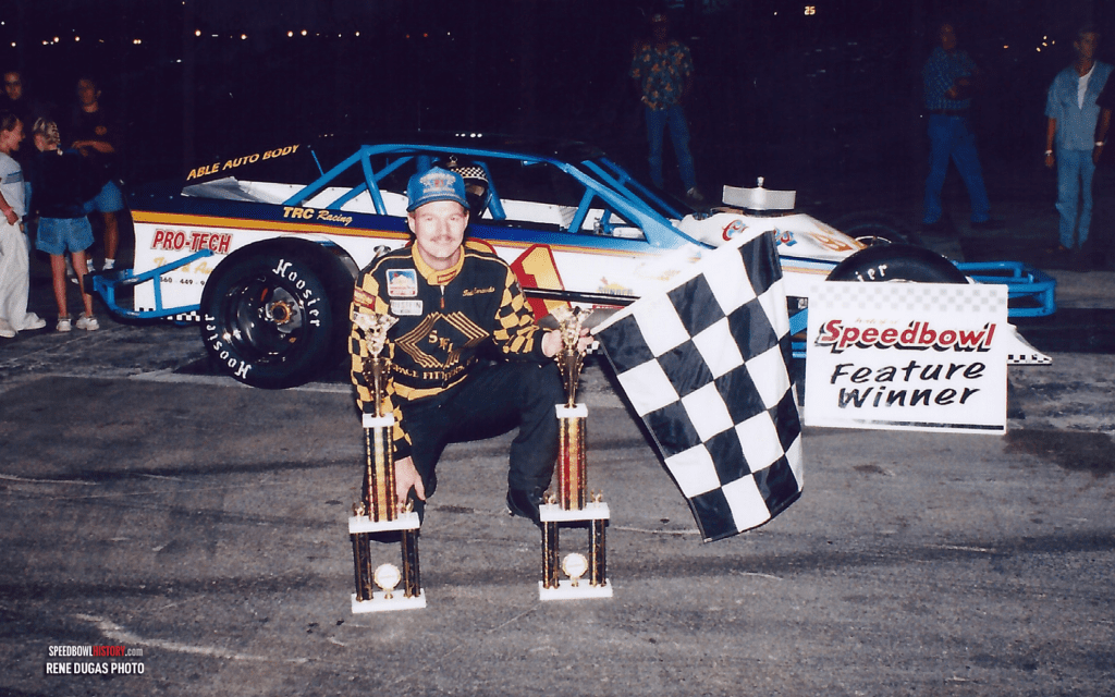 Black and white abstract pattern with concentric circles and wave shapes.