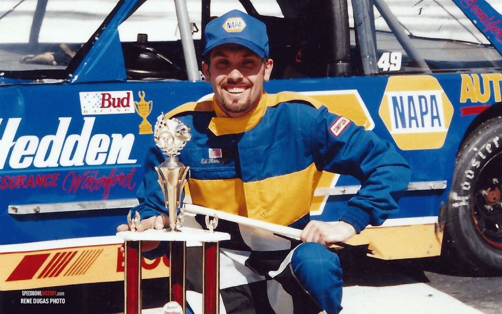 Black and white abstract pattern with concentric circles and wave shapes.