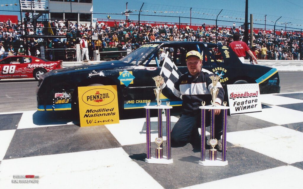 Black and white abstract pattern with concentric circles and wave shapes.