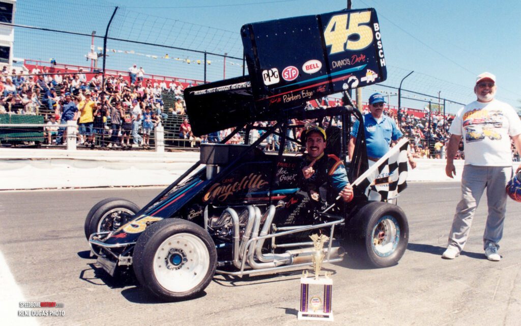 Black and white abstract pattern with concentric circles and wave shapes.