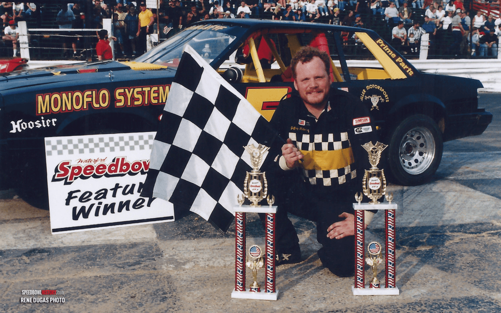 Black and white abstract pattern with concentric circles and wave shapes.