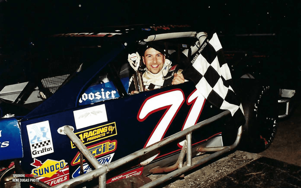 Black and white abstract pattern with concentric circles and wave shapes.