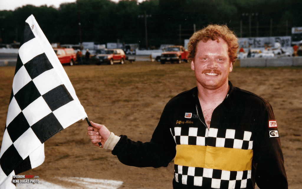 Black and white abstract pattern with concentric circles and wave shapes.