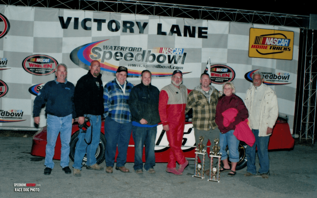 Black and white abstract pattern with concentric circles and wave shapes.