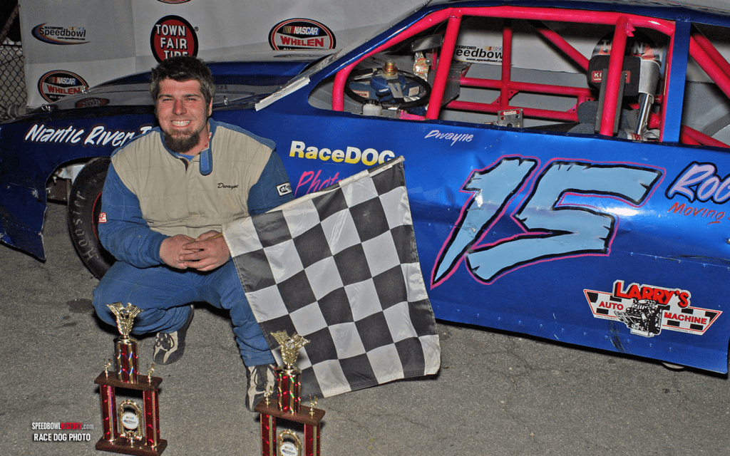 Black and white abstract pattern with concentric circles and wave shapes.