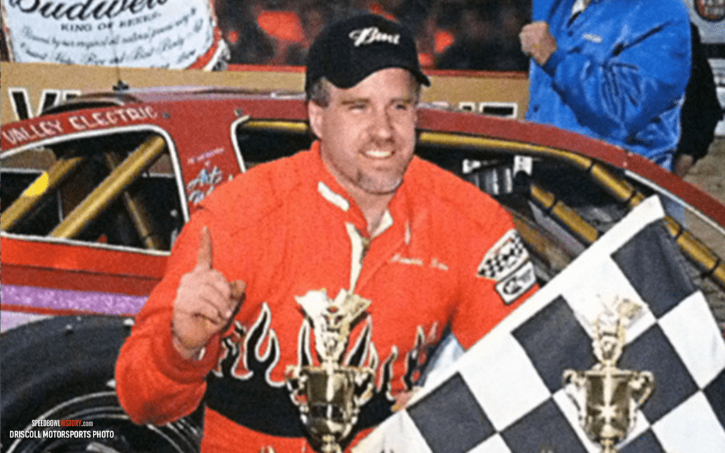 Black and white abstract pattern with concentric circles and wave shapes.