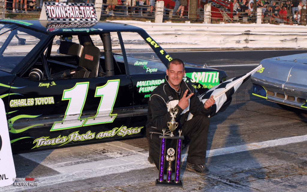 Black and white abstract pattern with concentric circles and wave shapes.