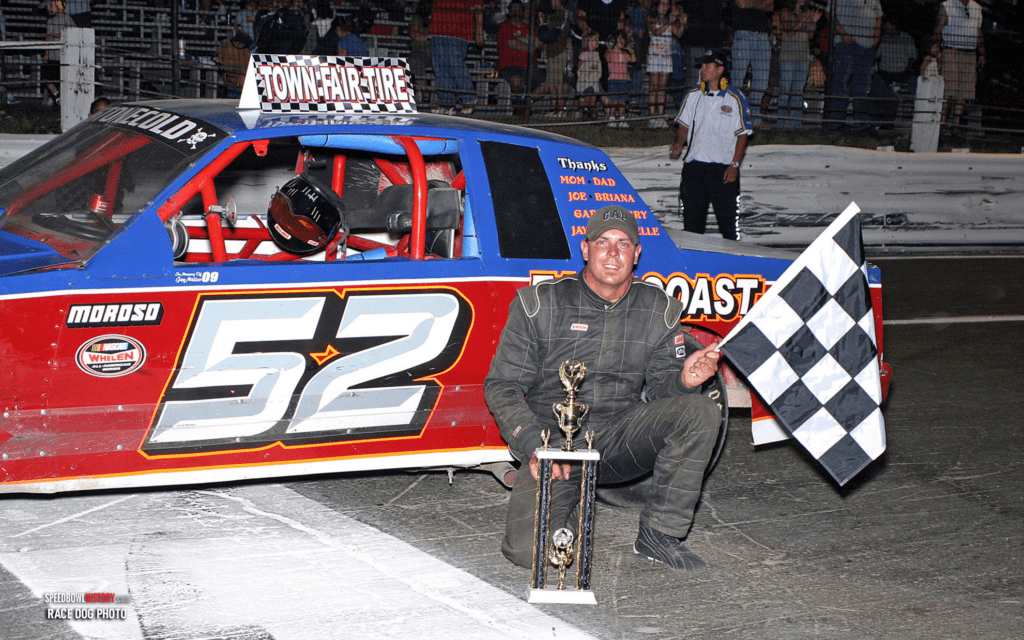 Black and white abstract pattern with concentric circles and wave shapes.