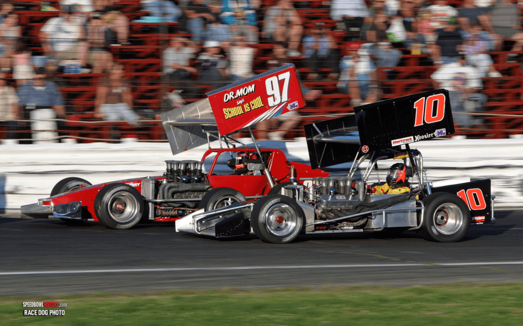 Black and white abstract pattern with concentric circles and wave shapes.