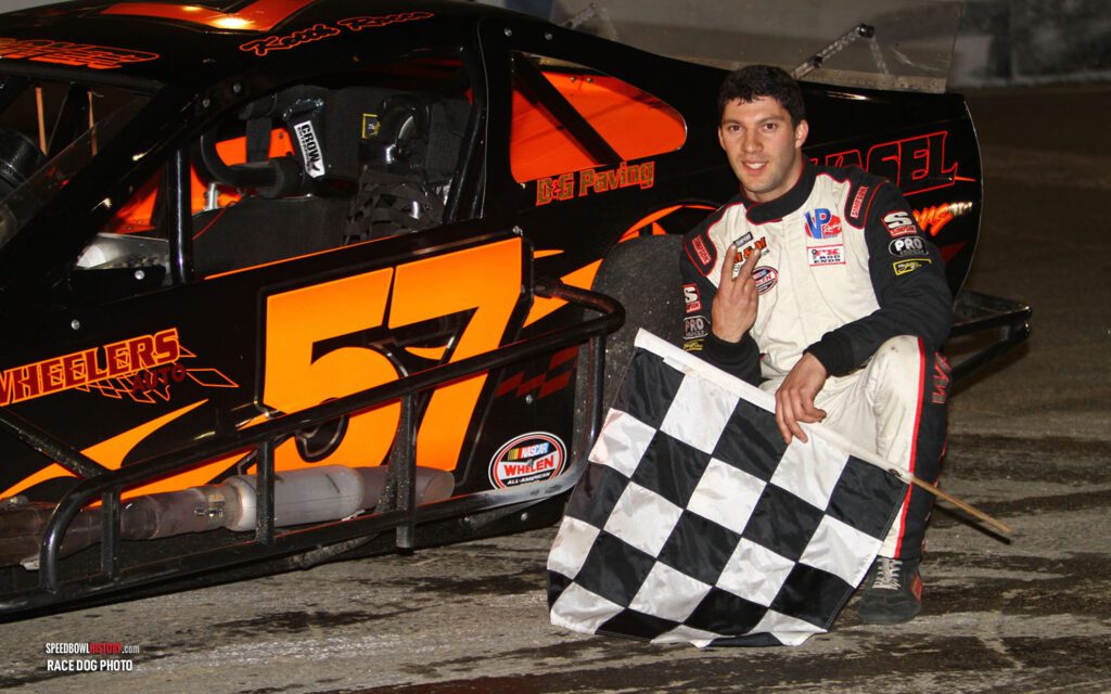 Black and white abstract pattern with concentric circles and wave shapes.