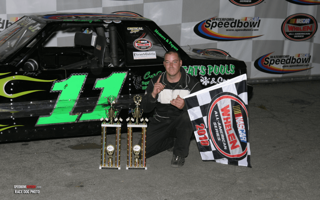 Black and white abstract pattern with concentric circles and wave shapes.