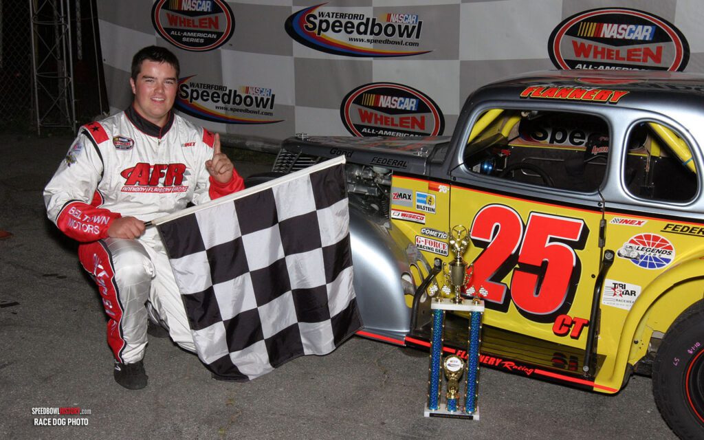 Black and white abstract pattern with concentric circles and wave shapes.