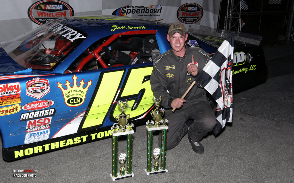 Black and white abstract pattern with concentric circles and wave shapes.