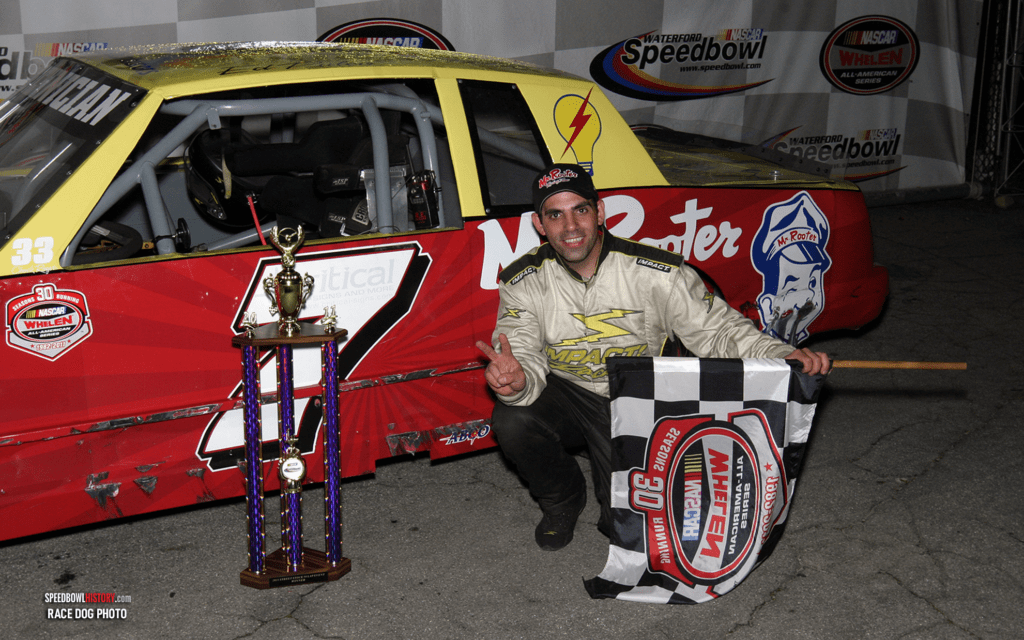 Black and white abstract pattern with concentric circles and wave shapes.