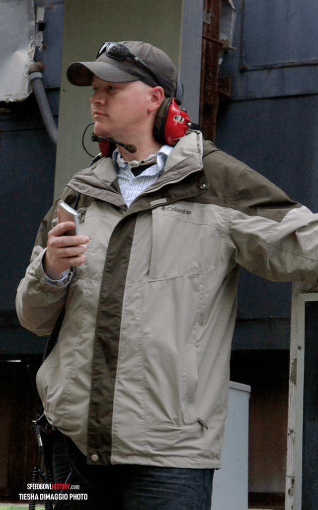 Black and white abstract pattern with concentric circles and wave shapes.