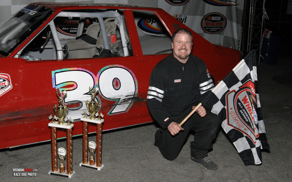 Black and white abstract pattern with concentric circles and wave shapes.