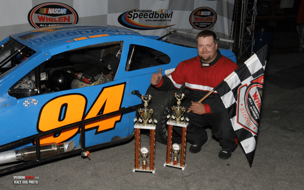 Black and white abstract pattern with concentric circles and wave shapes.