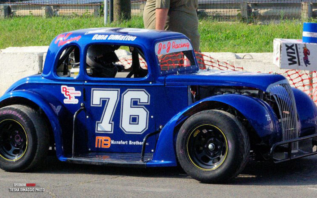Black and white abstract pattern with concentric circles and wave shapes.