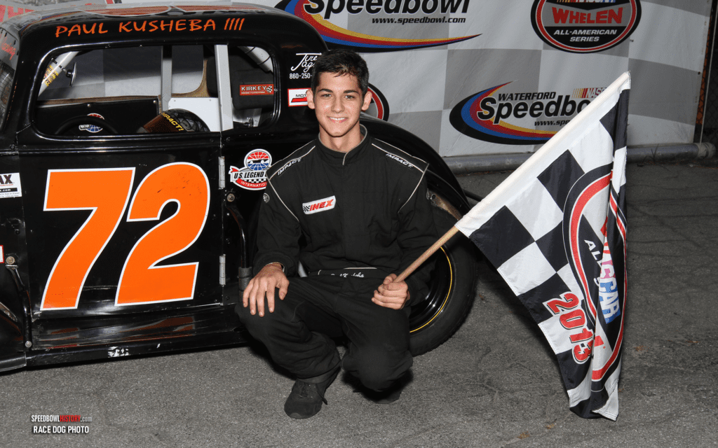 Black and white abstract pattern with concentric circles and wave shapes.