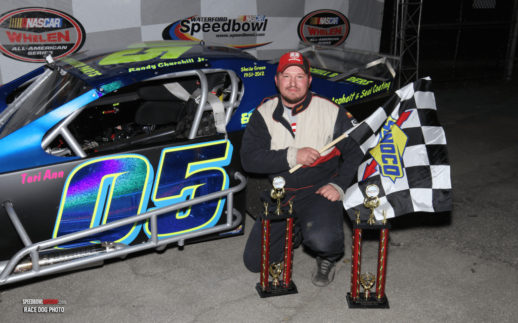 Black and white abstract pattern with concentric circles and wave shapes.