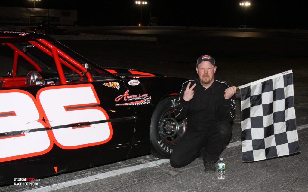 Black and white abstract pattern with concentric circles and wave shapes.