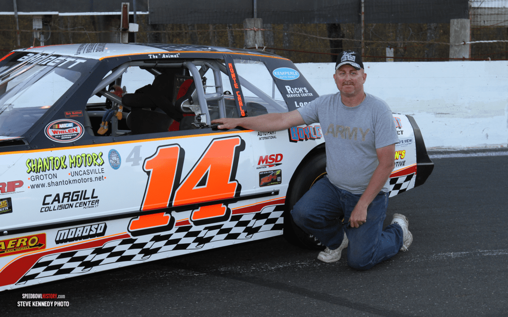 Black and white abstract pattern with concentric circles and wave shapes.