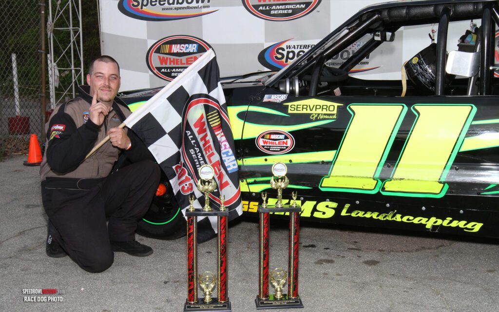 Black and white abstract pattern with concentric circles and wave shapes.