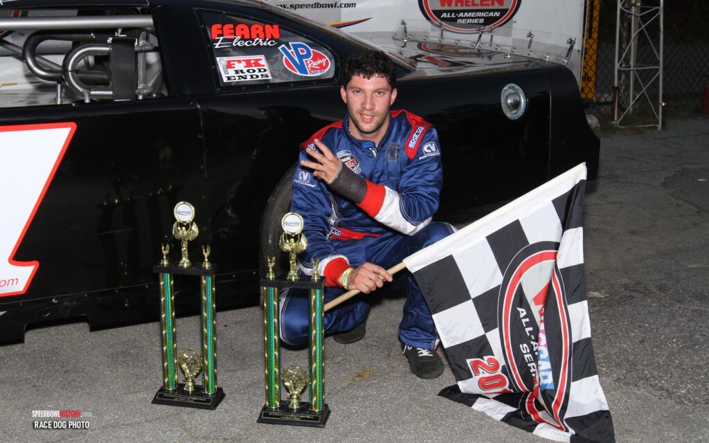 Black and white abstract pattern with concentric circles and wave shapes.