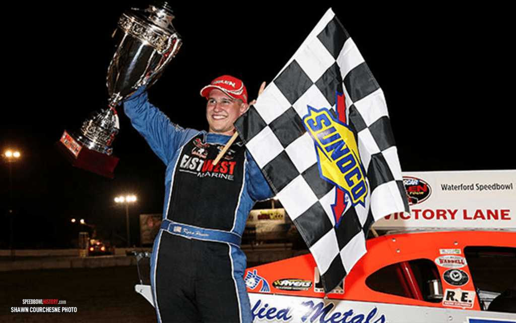 Black and white abstract pattern with concentric circles and wave shapes.