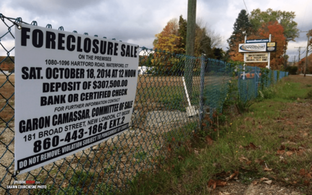 Black and white abstract pattern with concentric circles and wave shapes.